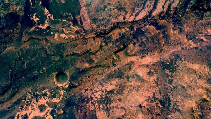 ExoMars Trace Gas Orbiter showing the region where the ancient Uzboi Vallis enters Holden crater in the southern hemisphere of Mars. The valley begins on the northern rim of the Argyre basin and was f ...