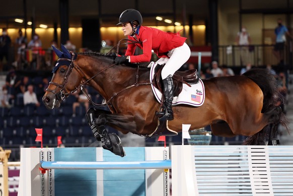 epa09400789 Jessica Springsteen of USA on Don Juan Van de Donkhoeve competes in the Jumping Team qualifier during the Equestrian events of the Tokyo 2020 Olympic Games at the Baji Koen Equestrian Park ...