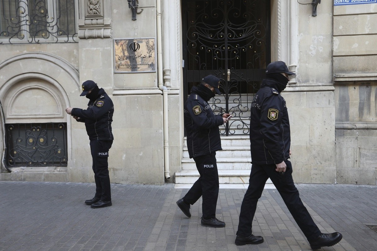 Police officers guard an area in front of the Iranian Embassy in Baku, Azerbaijan, Friday, Jan. 27, 2023. According to Azerbaijan's Foreign Ministry a man armed with a Kalashnikov-style rifle att ...