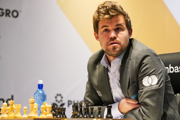 Magnus Carlsen of Norway competes during the FIDE World Championship at Dubai Expo 2020 in Dubai, United Arab Emirates, Friday, Dec. 10, 2021. (AP Photo/Jon Gambrell)
Magnus Carlsen