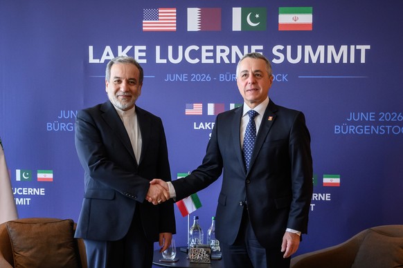 Iran's Foreign Minister Abbas Araghchi, left, shakes hands with Switzerland's Foreign Minister Ignazio Cassis at the Bürgenstock Resort in Obbuergen, near Lucerne, in Switzerland, Sunday, Ju ...