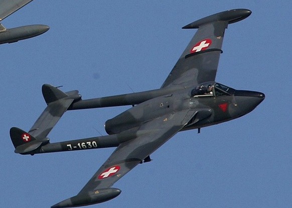A specially painted Hawker Hunter (L) a Hawker Hunter training plane, (C) and a DH-112 Venom,(R) vintage planes of the Swiss air force, fly in formation during the airshow Air 04, in Payerne, Switzerl ...