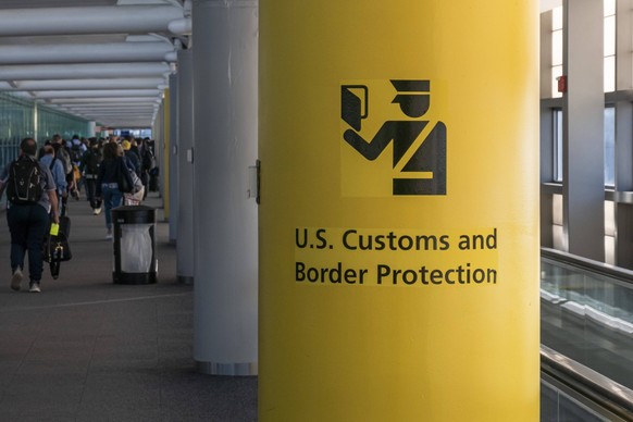 U.S. Customs And Border Protection Symbol U.S. Customs and Border Protection CBP sign, inscription and symbol in yellow background in Newark Liberty International Airport EWR serving the New York Metr ...