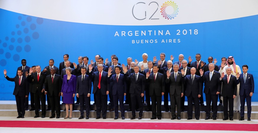 epa07199882 The Heads of State and Government of the G20 countries pose for the family picture during the G20 summit in Buenos Aires, Argentina, 30 November 2018. The Group of Twenty (G20) Summit brin ...