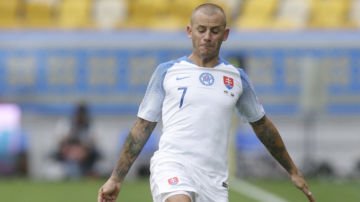 Ukraine's Oleksandr Karavaev, left, and Slovakia's Vladimir Weiss challenge for the ball during the UEFA Nations League soccer match between Ukraine and Slovakia at the Arena Lviv stadium in ...
