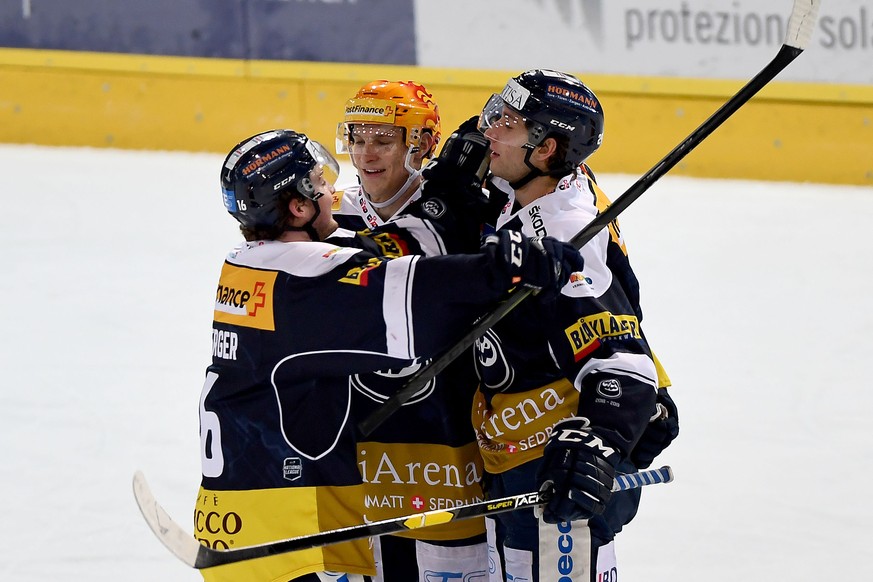Ambri&#039;s player Michael Fora, right, celebrate the 2 - 1 goal with Ambri&#039;s player Dominic Zwerger, left, and Ambri&#039;s player Dominik Kubalik, center, during the preliminary round game of  ...