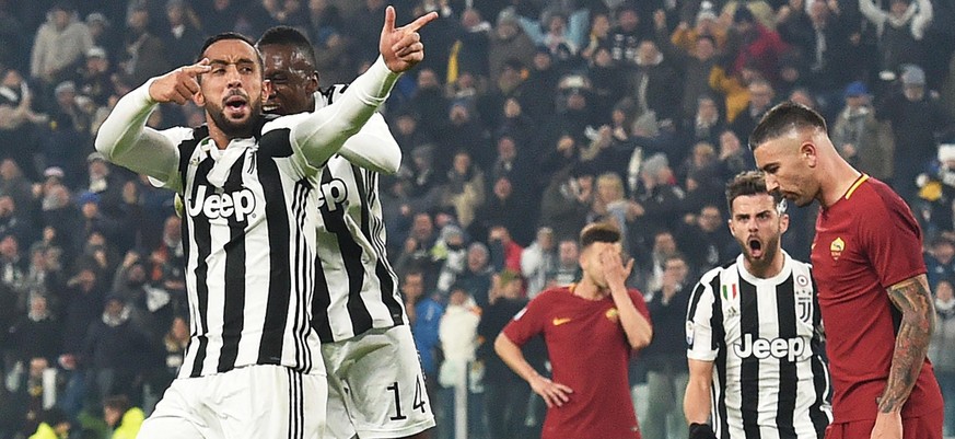 epa06404367 Juventus&#039; Medhi Benatia (L) celebrates after scoring a goal during the Italian Serie A soccer match Juventus FC vs AS Roma at Allianz Stadium in Turin, Italy, 23 December 2017. EPA/AN ...