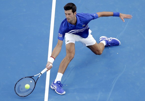 Serbia&#039;s Novak Djokovic hits a forehand return to United States&#039; Mitchell Krueger during their first round match at the Australian Open tennis championships in Melbourne, Australia, Tuesday, ...