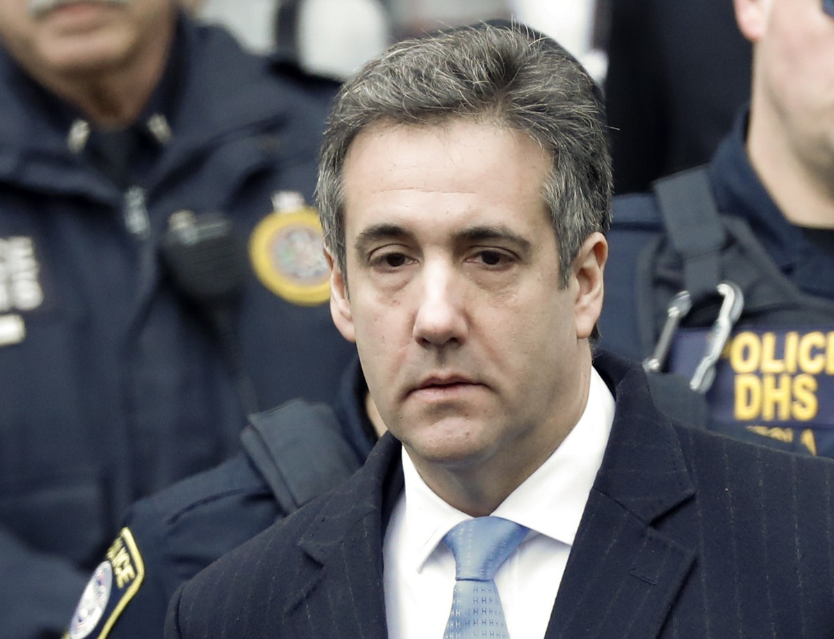 epa07226493 Michael Cohen, President Trump's former lawyer, departs United States Federal Court under heavy security after being sentenced to three years in prison in New York, New York, USA, 12  ...