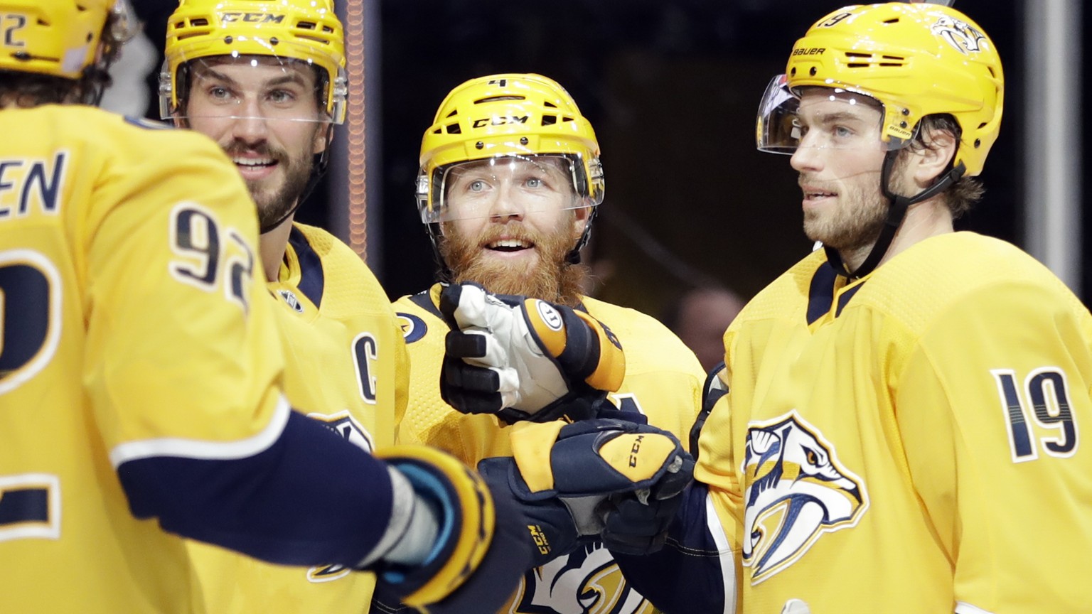 Nashville Predators defenseman Ryan Ellis (4) celebrates with Ryan Johansen (92); Roman Josi (59), of Switzerland; and Calle Jarnkrok (19), of Sweden, after Ellis scored a goal against the Vegas Golde ...