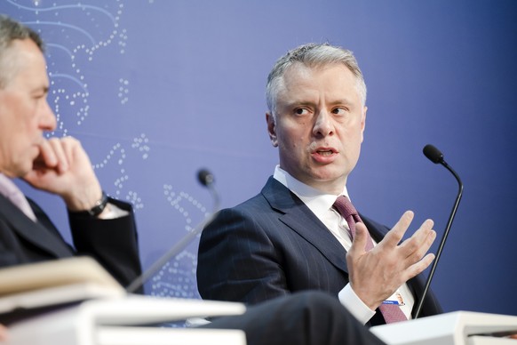 Yuriy Vitrenko, Chief Executive Officer, Naftogaz of Ukraine, Ukraine, right, attends a panel session next to Ignazio Cassis, President of the Swiss Confederation, left, at the Open Forum during the 5 ...