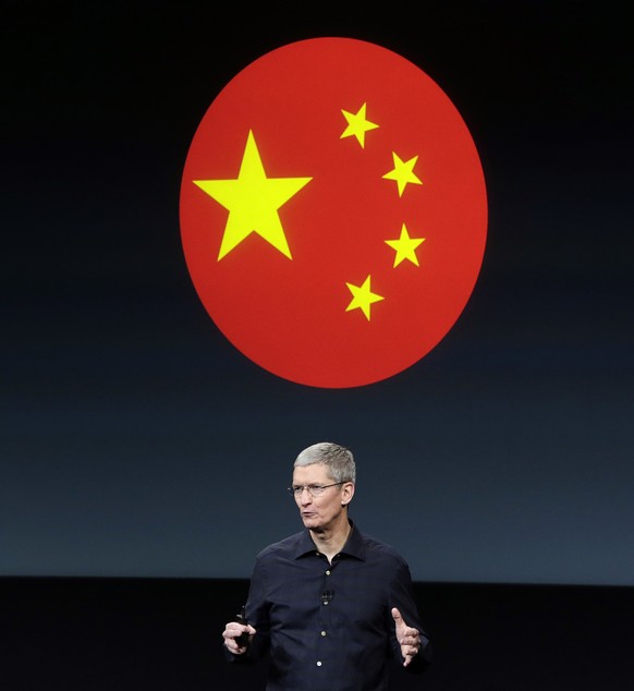 Apple CEO Tim Cook discusses the new products during an event at Apple headquarters on Thursday, Oct. 16, 2014 in Cupertino, Calif. (AP Photo/Marcio Jose Sanchez)