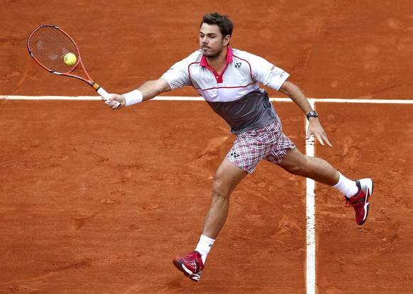 Stan Wawrinka of Switzerland plays a shot to Gilles Simon of France during their men&#039;s singles match at the French Open tennis tournament at the Roland Garros stadium in Paris, France, May 31, 20 ...