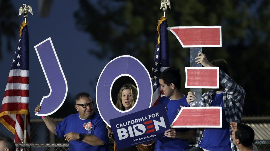 Supporters hold a sign before a campaign rally for Democratic presidential candidate former Vice President Joe Biden on Tuesday, March 3, 2020, in Los Angeles. (AP Photo/Marcio Jose Sanchez)
Joe Biden