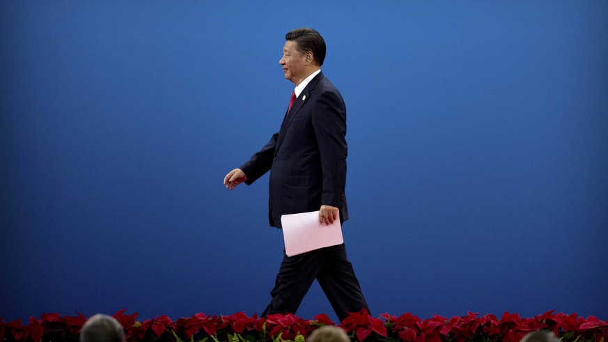 Chinese President Xi Jinping leaves the stage after speaking during the opening ceremony of the Belt and Road Forum at the China National Convention Center (CNCC) in Beijing, Sunday, May 14, 2017. (AP ...