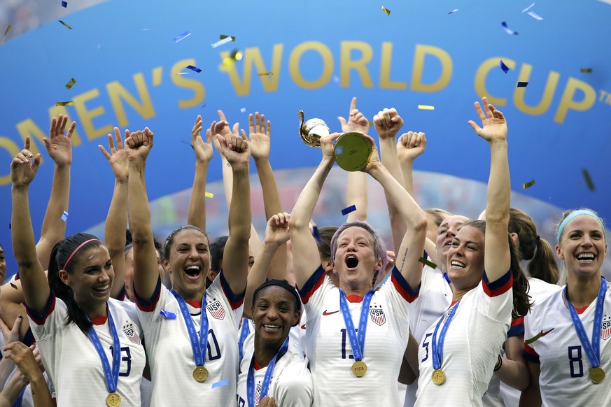 FILE - United States&#039; Megan Rapinoe lifts up the trophy after winning the Women&#039;s World Cup final soccer match between US and The Netherlands at the Stade de Lyon in Decines, outside Lyon, F ...
