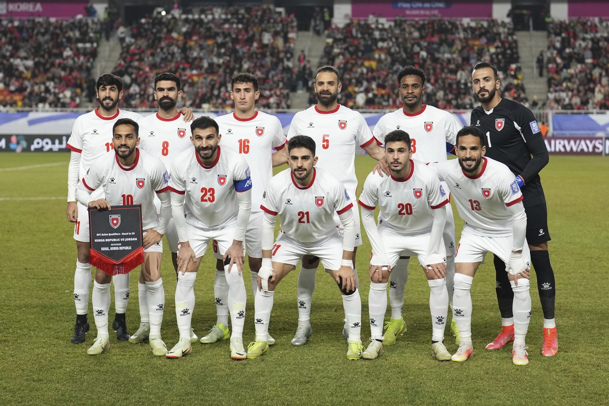 Jordan starting players pose for a team photo at the beginning of the third round of the Asian qualifier group B match between South Korea and Jordan for 2026 World Cup at Suwon World Cup Stadium in S ...