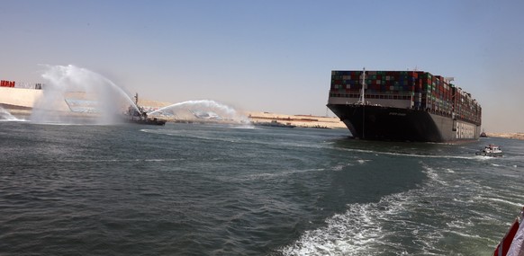 epa09328246 After reaching a settlement between Egypt&#039;s Suez Canal Authority and the owner, the Ever Given ship set to sail from Great Bitter Lake near Ismailia Governorate, Egypt, 07 July 2021.  ...