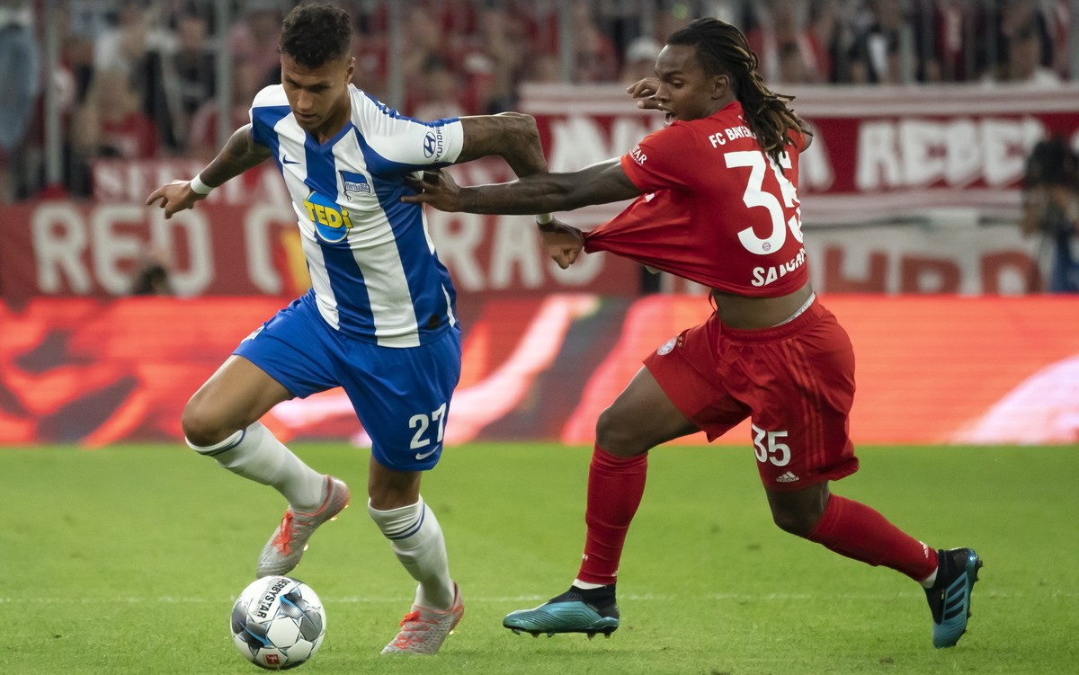 epa07776734 Bayern's Renato Sanches (R) in action against Hertha's Davie Selke (L) during the German Bundesliga soccer match between FC Bayern Munich and Hertha BSC Berlin in Munich, Germany ...