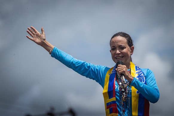 epa12444141 (FILE) Maria Corina Machado speaks to supporters during a caravan to promote the vote for the presidential candidate of the main opposition alliance in Venezuela, Edmundo Gonzalez Urrutia, ...