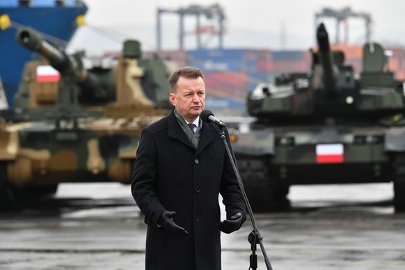 epa10351184 Polish Defence Minister Mariusz Blaszczak speaks during the delivery of South Korean K2 tanks and K9 howitzers for the Polish army at the Container Terminal in Gdynia, northern Poland, 06  ...