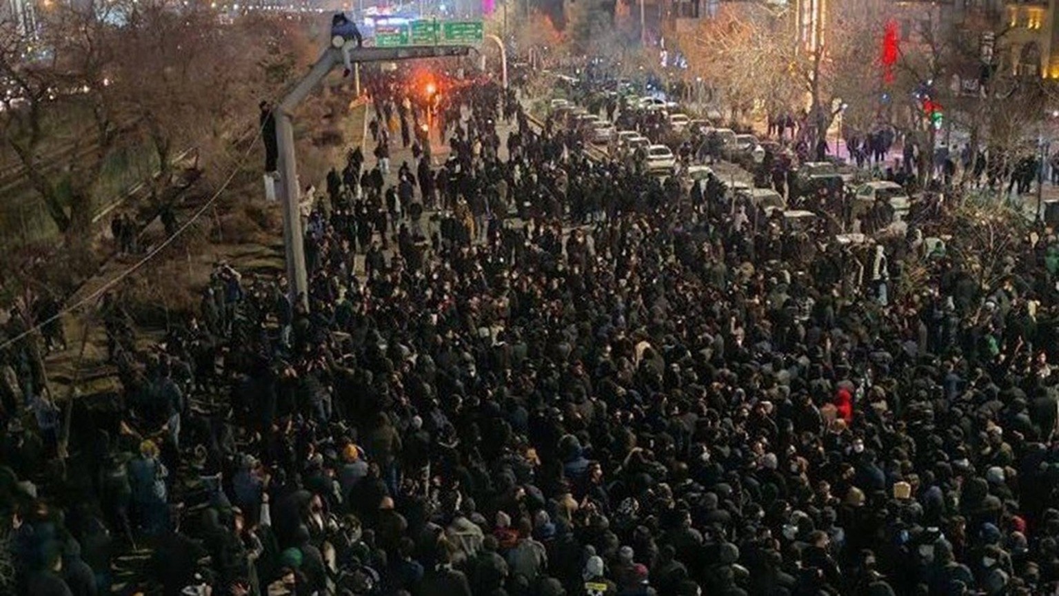Large crowds of protesters march through the streets of Mashhad, northeastern Iran on January 8, 2026