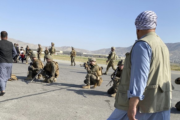 U.S soldiers take a position to guard along a perimeter at the international airport in Kabul, Afghanistan, Monday, Aug. 16, 2021. On Monday, the U.S. military and officials focus was on Kabul���s air ...