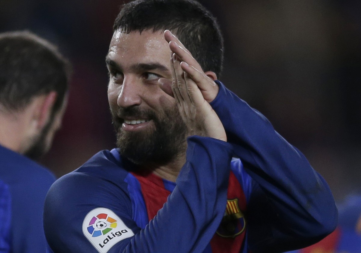 FC Barcelona's Arda Turan reacts after scoring a goal against Hercules during their Copa del Rey, Spain's King's Cup soccer match at the Camp Nou in Barcelona, Spain, Wednesday, Dec. 21 ...