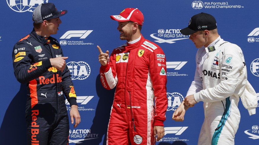 epa06797500 German Formula One driver Sebastian Vettel of Scuderia Ferrari (C), Finnish Formula One driver Valtteri Bottas of Mercedes AMG GP (R) and Dutch Formula One driver Max Verstappen of Aston M ...