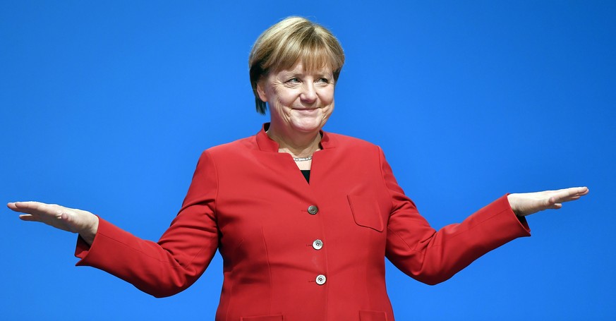 German Chancellor and Chairwomen of the CDU, Angela Merkel, gestures after her speech as part of a general party conference of the Christian Democratic Union (CDU) in Essen, Germany, Tuesday, Dec. 6,  ...