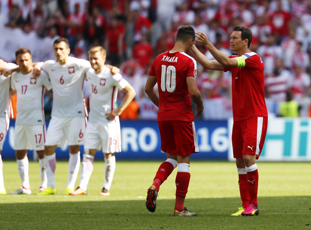 Football Soccer - Switzerland v Poland - EURO 2016 - Round of 16 - Stade Geoffroy-Guichard, Saint-Étienne, France - 25/6/16
Switzerland's Granit Xhaka is consoled by Stephan Lichtsteiner after m ...