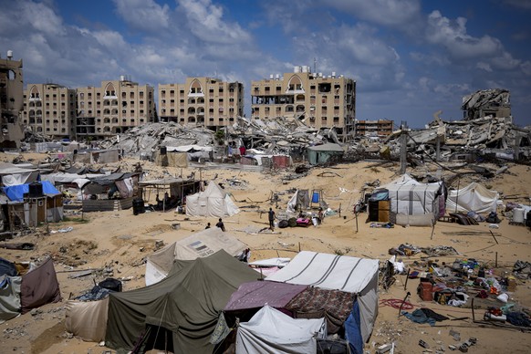 Palestinians displaced by the Israeli air and ground offensive on the Gaza Strip flee from Hamad City, following an evacuation order by the Israeli army to leave parts of the southern area of Khan You ...