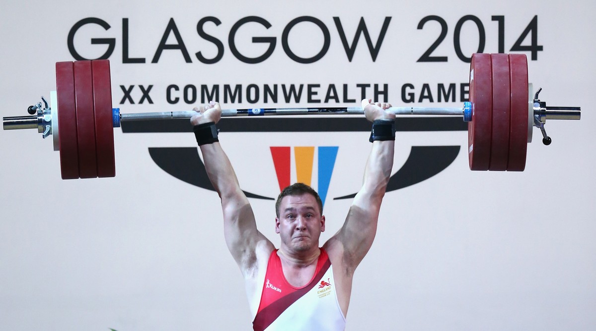 GLASGOW, SCOTLAND - JULY 30: Ben Watson of England lifts during the Men's Weighlifting 75kg Group A Final at Scottish Exhibition And Conference Centre during day seven of the Glasgow 2014 Commonw ...