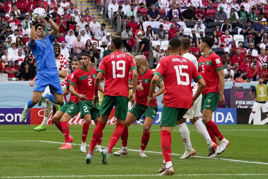 Morocco goalkeeper Yassine Bounou grabs the ball during the World Cup group F soccer match between Morocco and Croatia, at the Al Bayt Stadium in Al Khor , Qatar, Wednesday, Nov. 23, 2022. (AP Photo/T ...