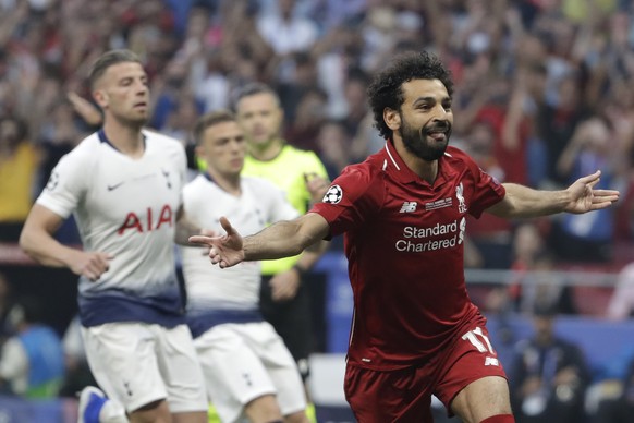 Liverpool's Mohamed Salah celebrates after scoring his side's opening goal during the Champions League final soccer match between Tottenham Hotspur and Liverpool at the Wanda Metropolitano Stadium in Madrid, Saturday, June 1, 2019. (AP Photo/Felipe Dana)