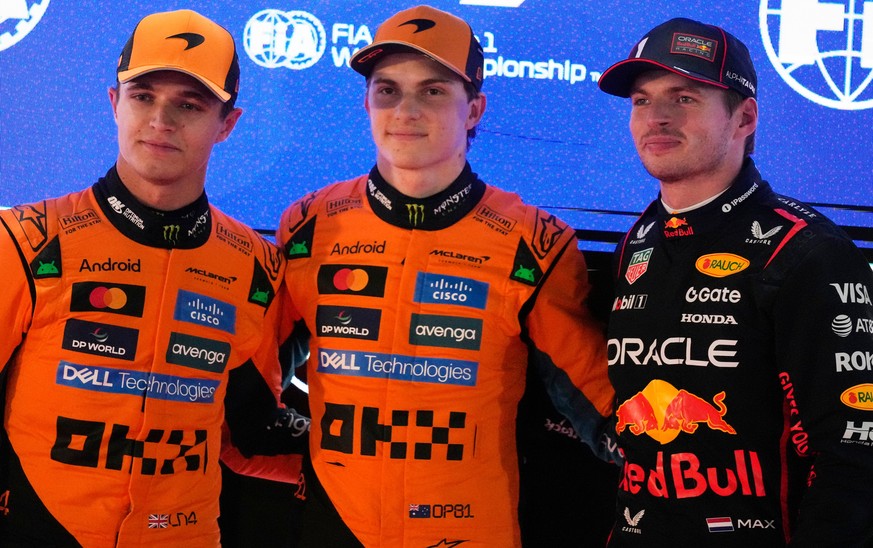 McLaren driver Oscar Piastri of Australia, pole position, center, is flanked by second best time McLaren driver Lando Norris of Britain, and Red Bull driver Max Verstappen of the Netherlands after the ...