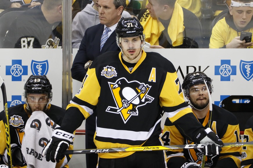 Pittsburgh Penguins head coach Mike Sullivan stands behind Nick Bonino (13), Evgeni Malkin (71), and Chris Kunitz (14) during the third period of Game 6 in an NHL Stanley Cup Eastern Conference semifi ...