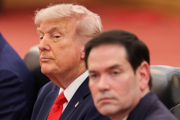 U.S. President Donald Trump, left, seated next to U.S. Secretary of State Marco Rubio, right, attends a bilateral meeting with Chinese President Xi Jinping at the Great Hall of the People in Beijing,  ...