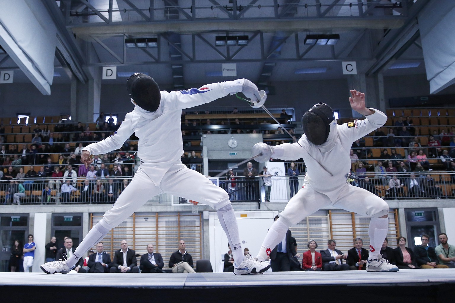 Swiss fencer Max Heinzer, right, fights against Jean-Michel Lucenay of France during the final of the team event at the Grand Prix Bern epee fencing world cup tournament in Bern, Switzerland, Sunday,  ...