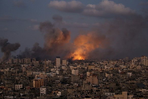 epa10915461 Smoke rises following an Israeli air strike in northern Gaza City, 12 October 2023. More than 1,400 Palestinians have been killed and over 6,000 others injured, according to the Palestinia ...