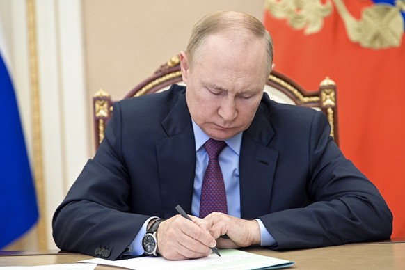 Russian President Vladimir Putin attends a meeting on metals industries via videoconference in Moscow, Russia, Monday, Aug. 1, 2022. (Pavel Byrkin, Sputnik, Kremlin Pool Photo via AP)