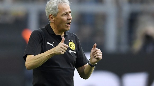 Dortmund&#039;s head coach Lucien Favre shows thumbs up after winning the German Bundesliga soccer match between Borussia Dortmund and RB Leipzig in Dortmund, Germany, Sunday, Aug. 26, 2018. (AP Photo ...