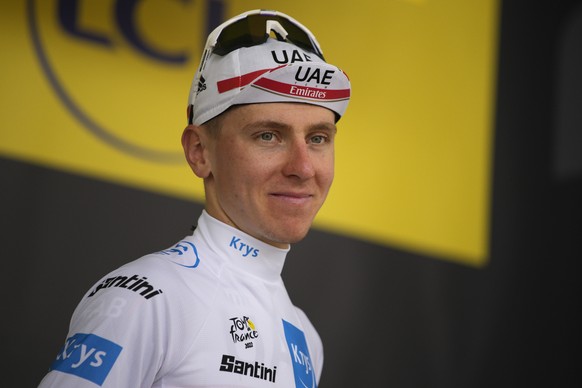 Slovenia's Tadej Pogacar, wearing the best young rider's white jersey arrives on the podium after the nineteenth stage of the Tour de France cycling race over 188.5 kilometers (117.3 miles) with start ...