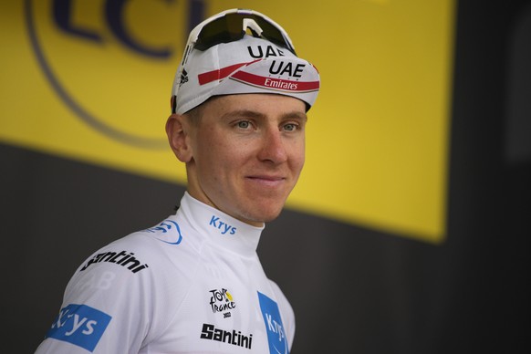 Slovenia&#039;s Tadej Pogacar, wearing the best young rider&#039;s white jersey arrives on the podium after the nineteenth stage of the Tour de France cycling race over 188.5 kilometers (117.3 miles)  ...