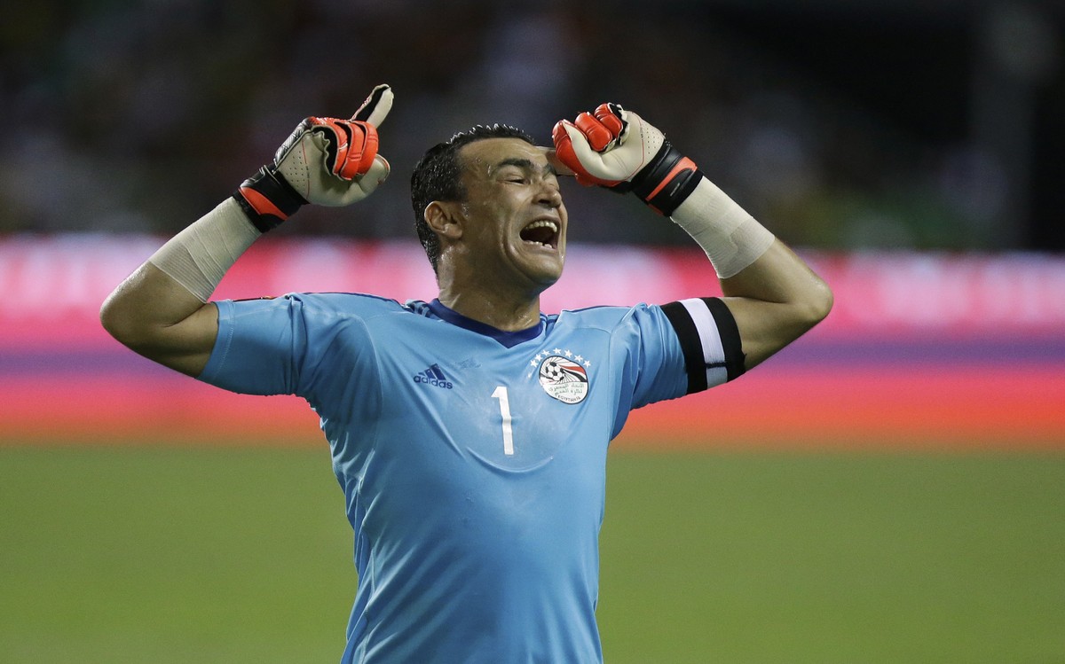 Egypt goalkeeper Essam El Hadary celebrates after Egypt's Mohamed Elneny scored the opening goal during the African Cup of Nations final soccer match between Egypt and Cameroon at the Stade de l& ...