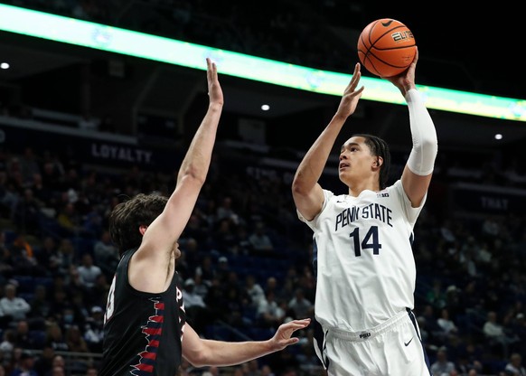 NCAA, College League, USA Basketball: Pennsylvania at Penn State Dec 29, 2024 University Park, Pennsylvania, USA Penn State Nittany Lions forward Yanic Konan Niederhauser 14 drives the ball to the bas ...