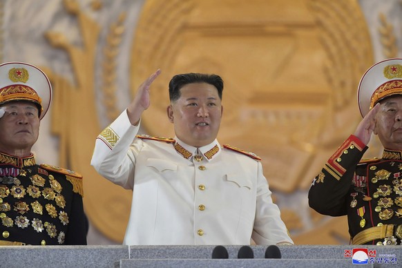 FILE - In this photo provided by the North Korean government, North Korean leader Kim Jong Un, center, watches a military parade to mark the 90th anniversary of North Korea&#039;s army at the Kim Il S ...