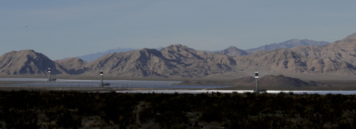 Some of the 300,000 computer-controlled mirrors, each about 7 feet high and 10 feet wide, reflect sunlight to boilers that sit on 459-foot towers. The sun's power is used to heat water in the boi ...