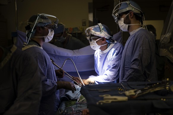 FILE - In this Tuesday, Jan. 23, 2018 file photo, a doctor, center, directs a special camera to look at a patient&#039;s tumor at a hospital in Philadelphia. According to research released on Wednesda ...