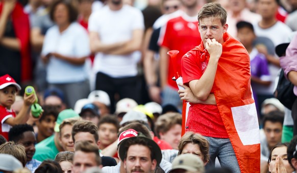 Swiss supporters react during the public viewing of the FIFA 2018 World Cup round of 16 soccer match between Switzerland and Sweden, in a fan zone in Vevey, Switzerland, Tuesday, July 3, 2018. (KEYSTO ...